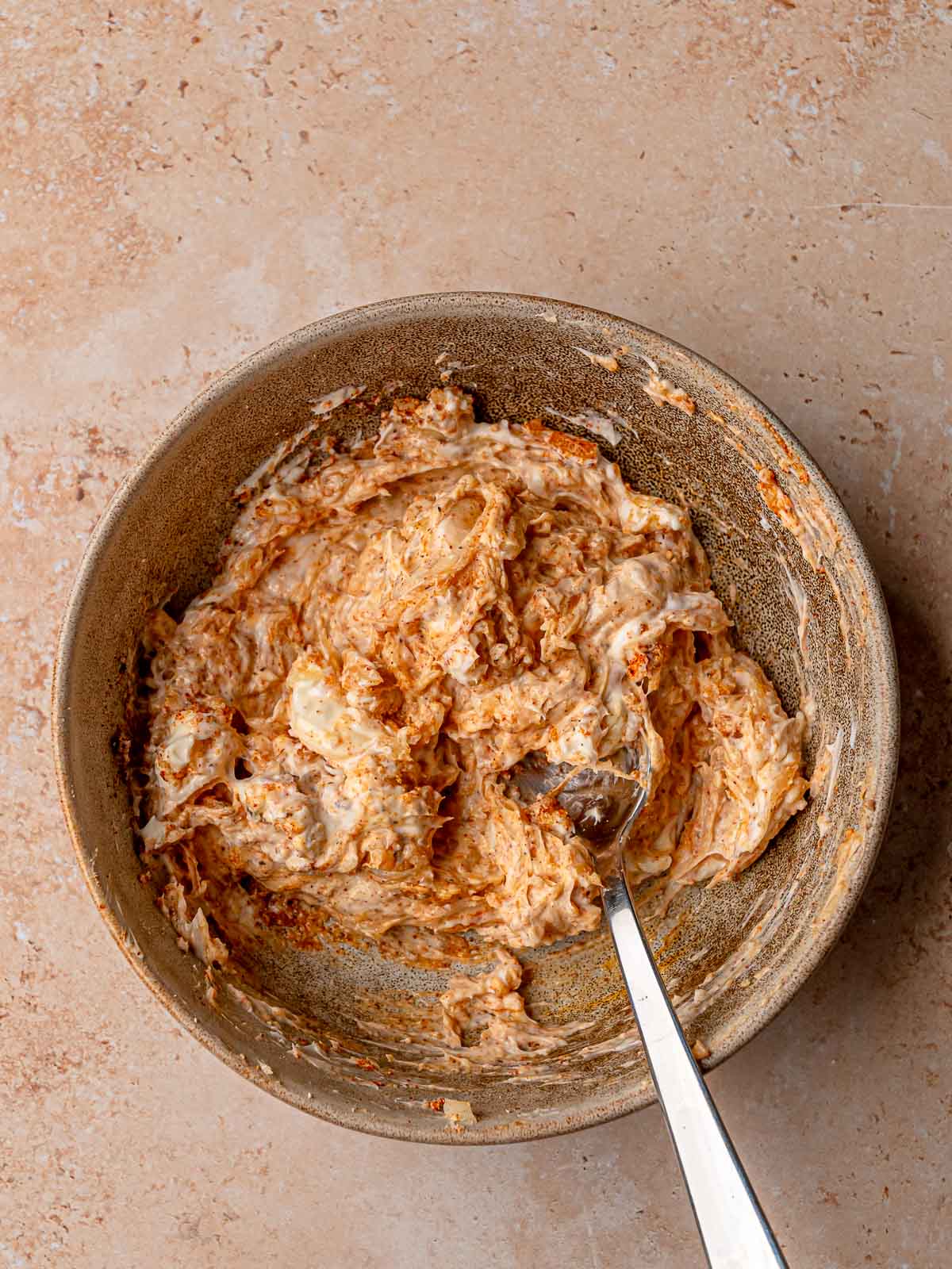 Creamy cheese filling mixed until smooth and ready to be added to jalapeños.