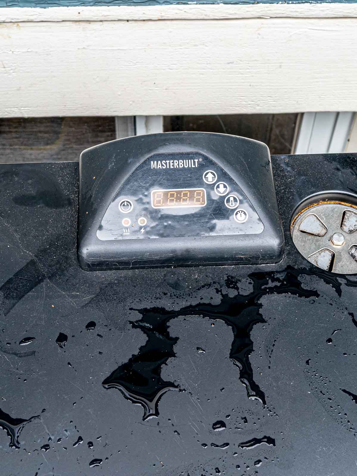 Control panel on the top of a Masterbuilt electric smoker.